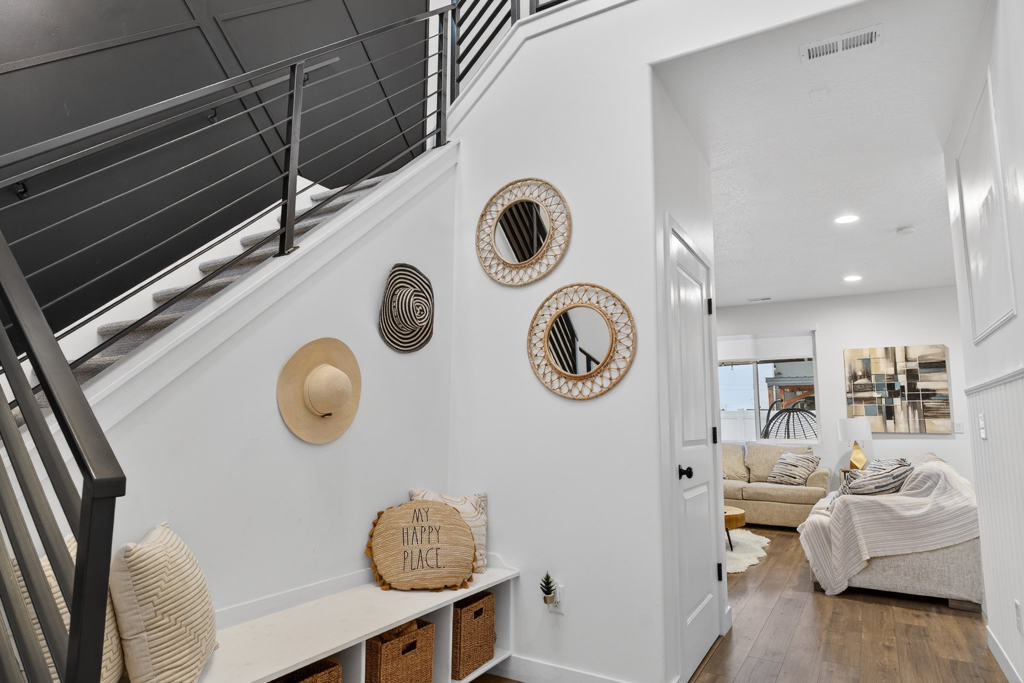 Staircase with hardwood / wood-style flooring and recessed lighting