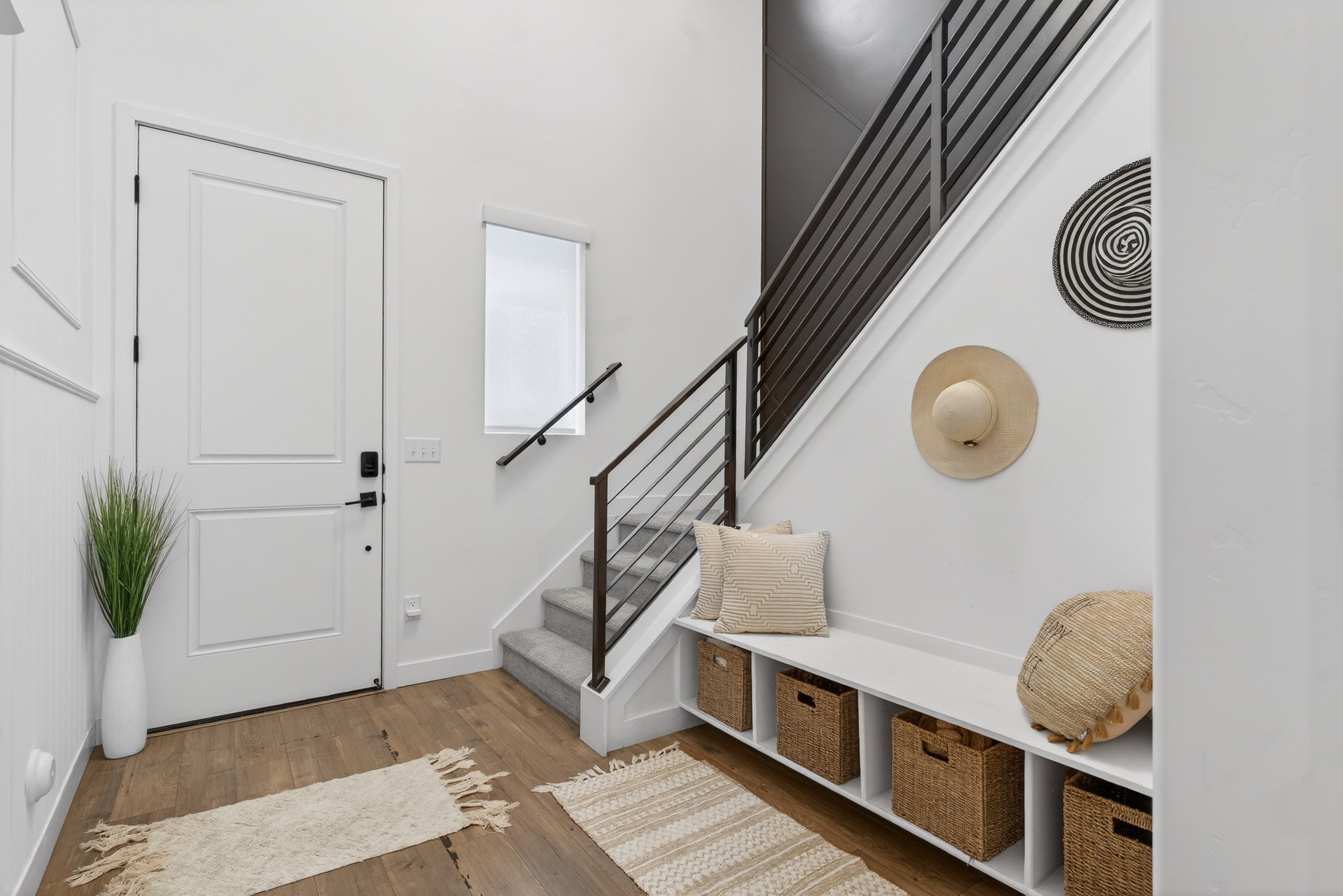 Foyer featuring stairs and light wood-style flooring