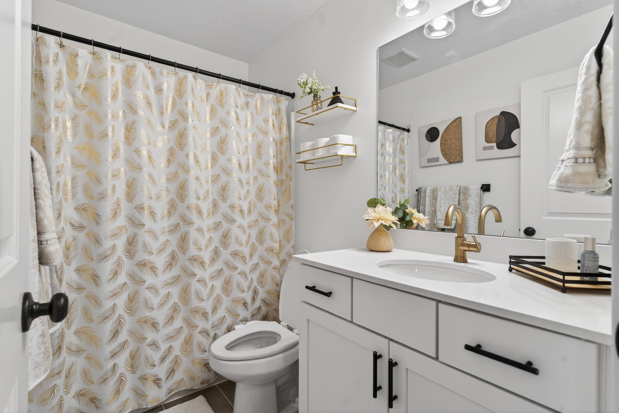Bathroom featuring vanity and a shower with shower curtain