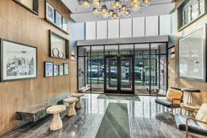 Lobby with wooden walls and a high ceiling