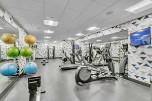 Exercise room featuring a paneled ceiling