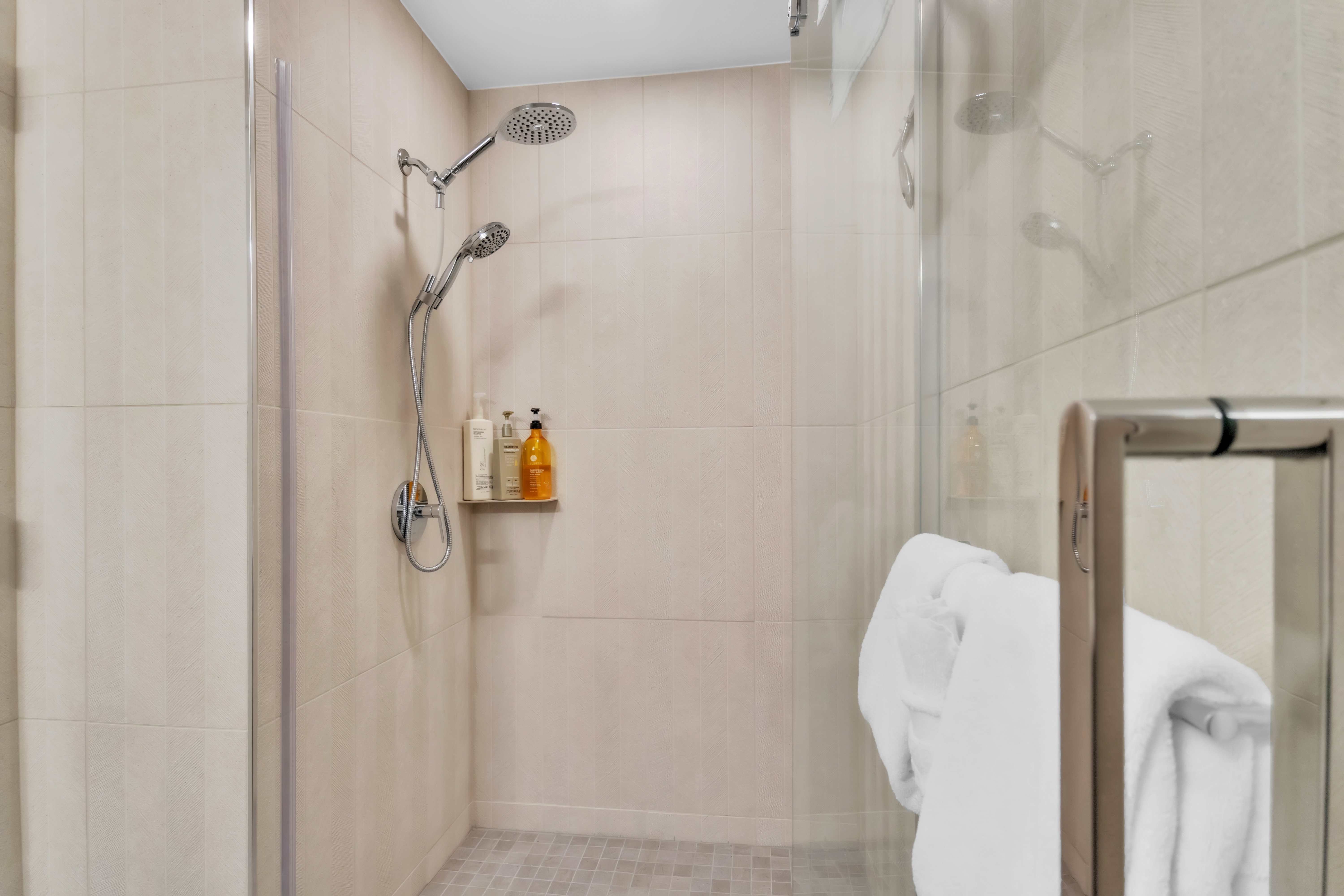 Full bath featuring a shower stall