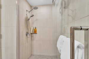 Full bath featuring a shower stall