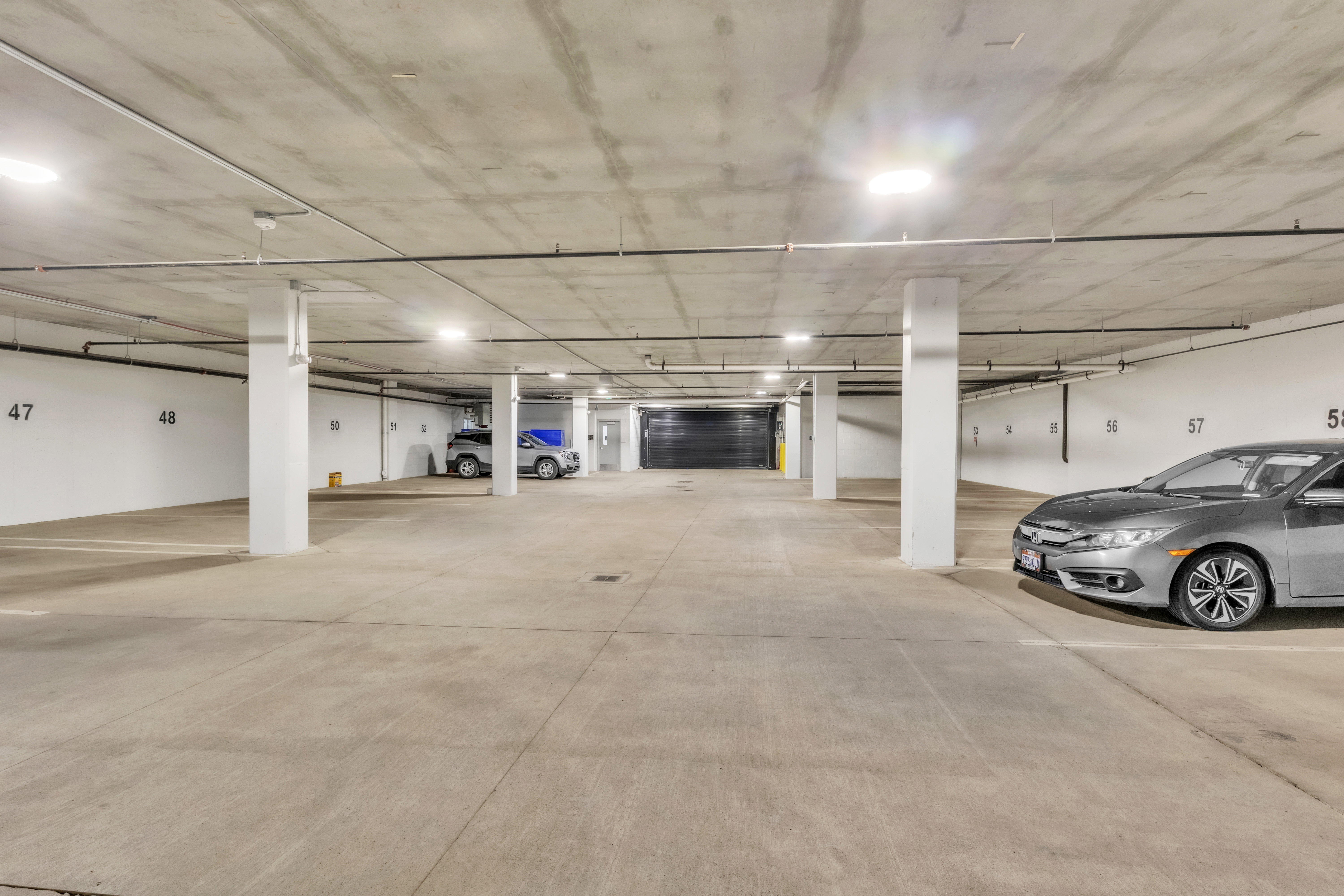 Garage featuring a parking garage