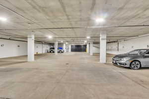 Garage featuring a parking garage