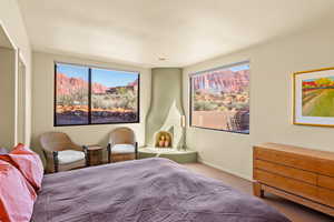 Bedroom featuring carpet flooring and baseboards