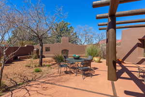 Fenced backyard featuring outdoor dining area and a patio area