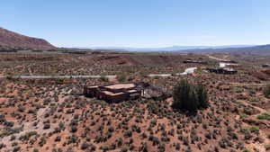 View of mountain backdrop with a desert landscape and rural landscape