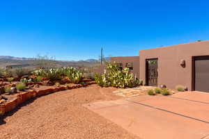 View of yard featuring a mountain view and a garage