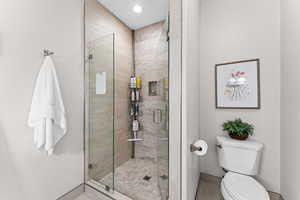 Full bath with a stall shower and recessed lighting