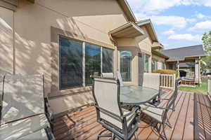 Wooden terrace with outdoor dining area