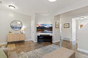 Living room with wood finished floors and baseboards