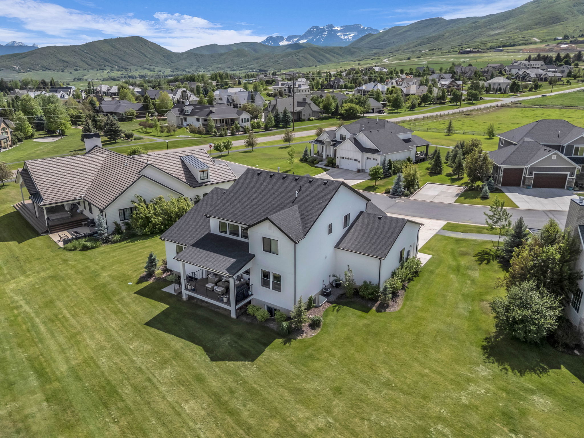 Aerial view of residential area with a mountainous background