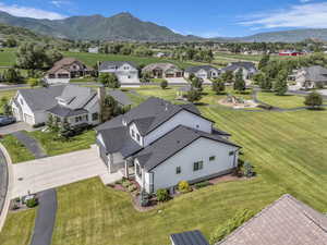 Aerial view of residential area featuring a mountainous background