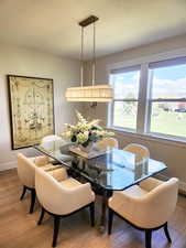 Dining space featuring baseboards and light wood-type flooring