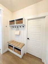 Mudroom with light wood-type flooring