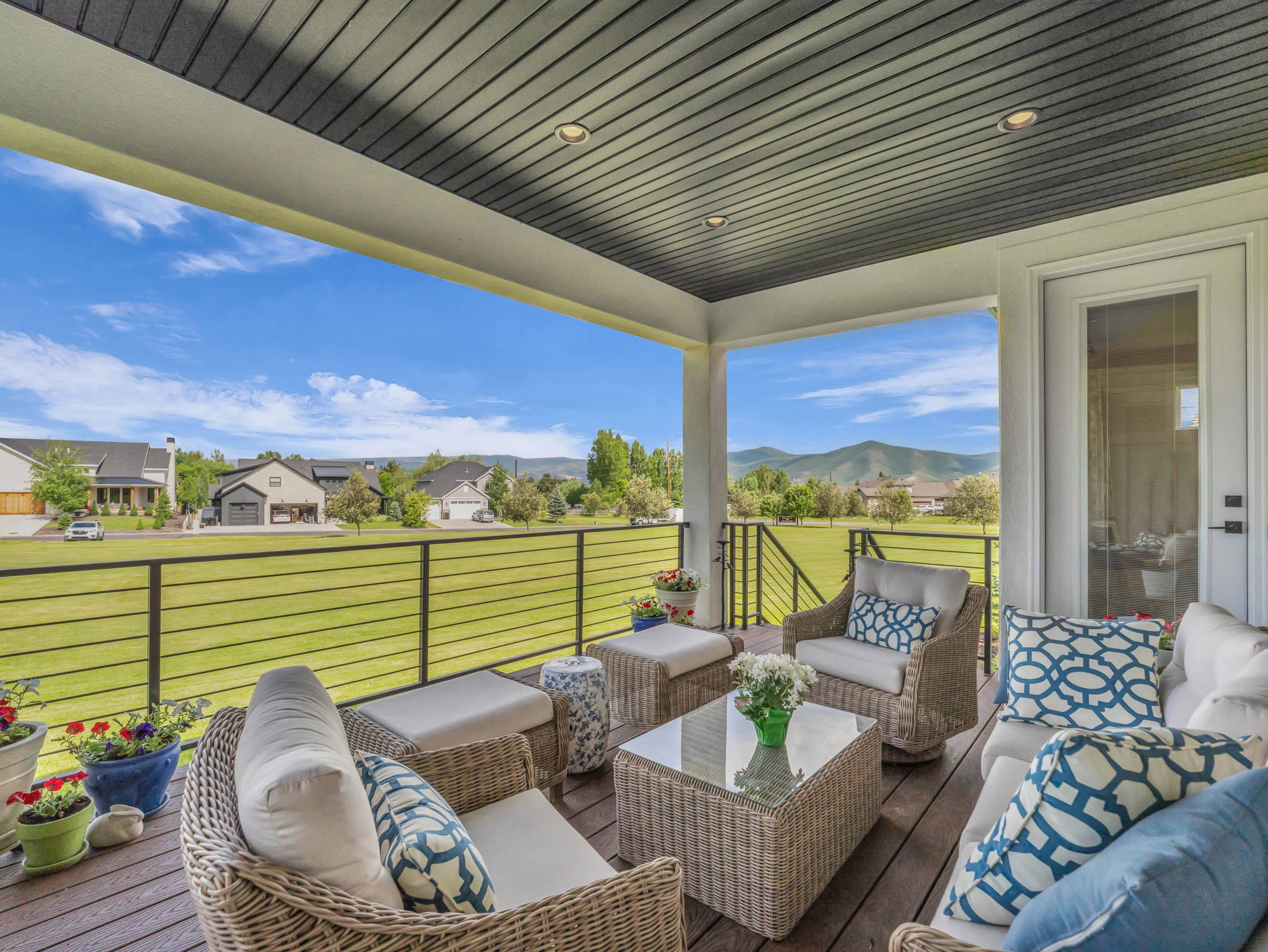 Deck with a lawn and an outdoor living space