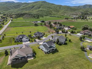 Aerial view of residential area featuring a mountainous background