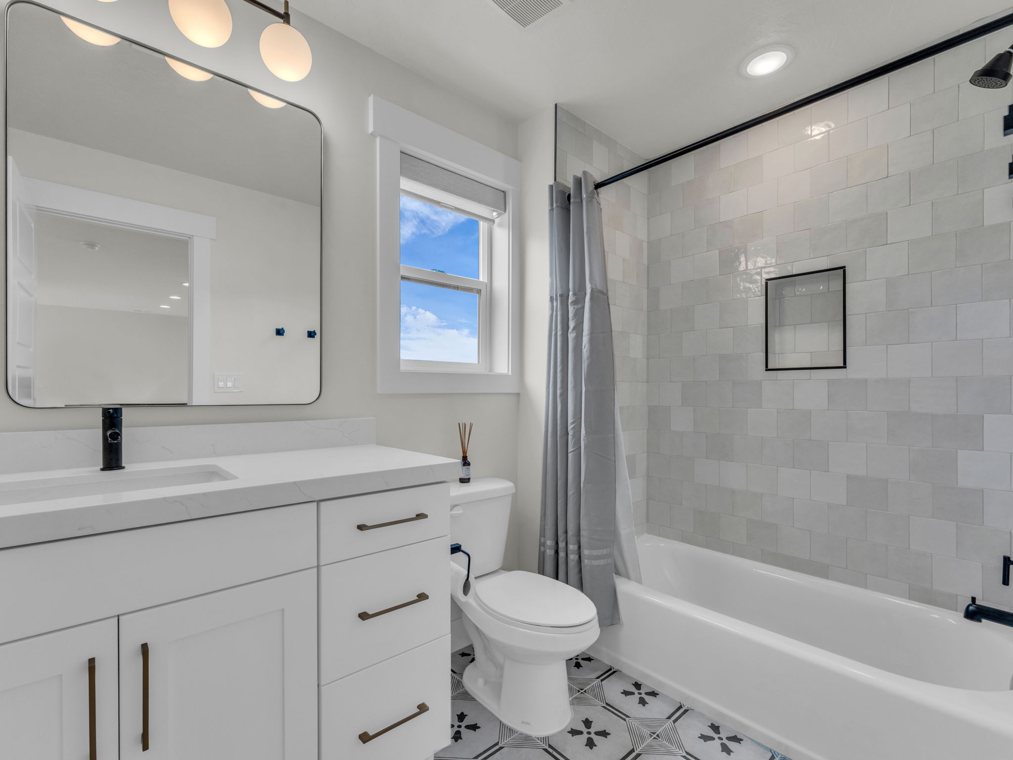 Full bathroom featuring vanity, shower / bath combo, recessed lighting, and light tile patterned flooring
