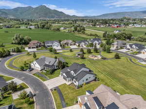 Aerial perspective of suburban area with a mountainous background