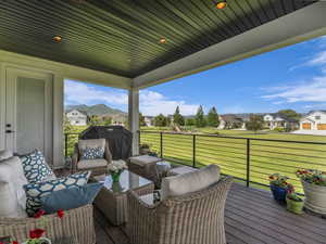 Deck with a residential view and grilling area