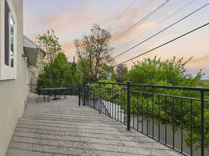 Deck at dusk featuring outdoor dining area