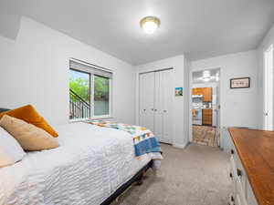 Bedroom featuring a closet and light carpet