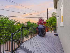 Deck at dusk with area for grilling