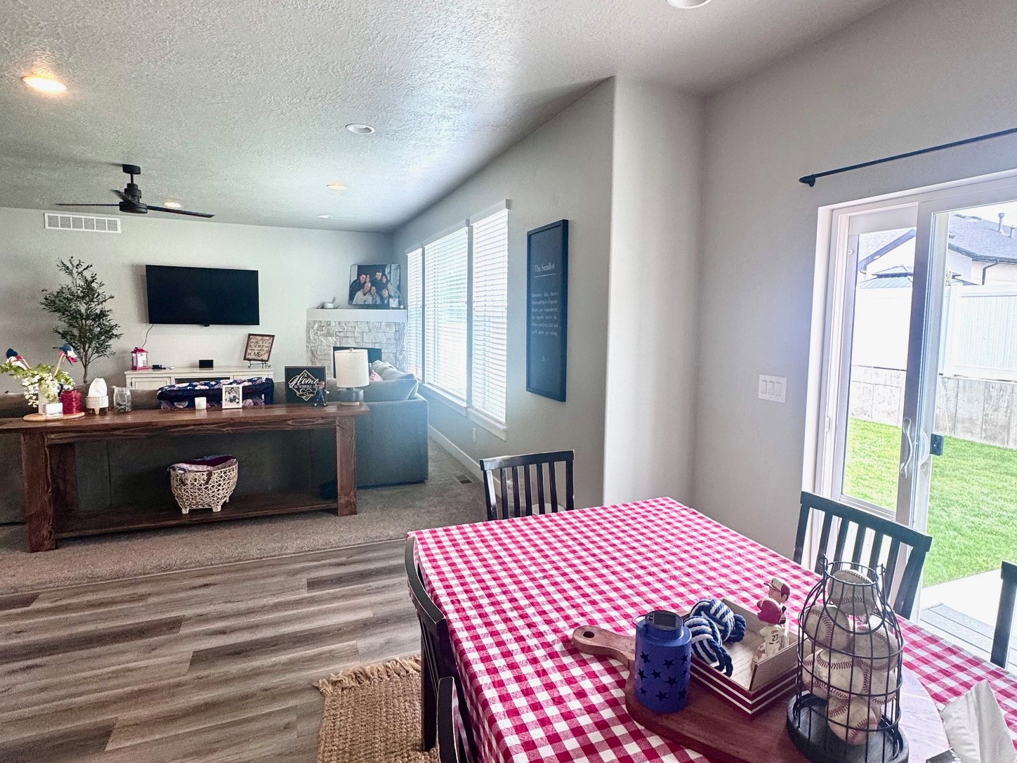 Dining space featuring recessed lighting, a textured ceiling, a ceiling fan, and wood finished floors