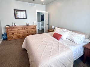 Bedroom with dark carpet, recessed lighting, a ceiling fan, and a textured ceiling