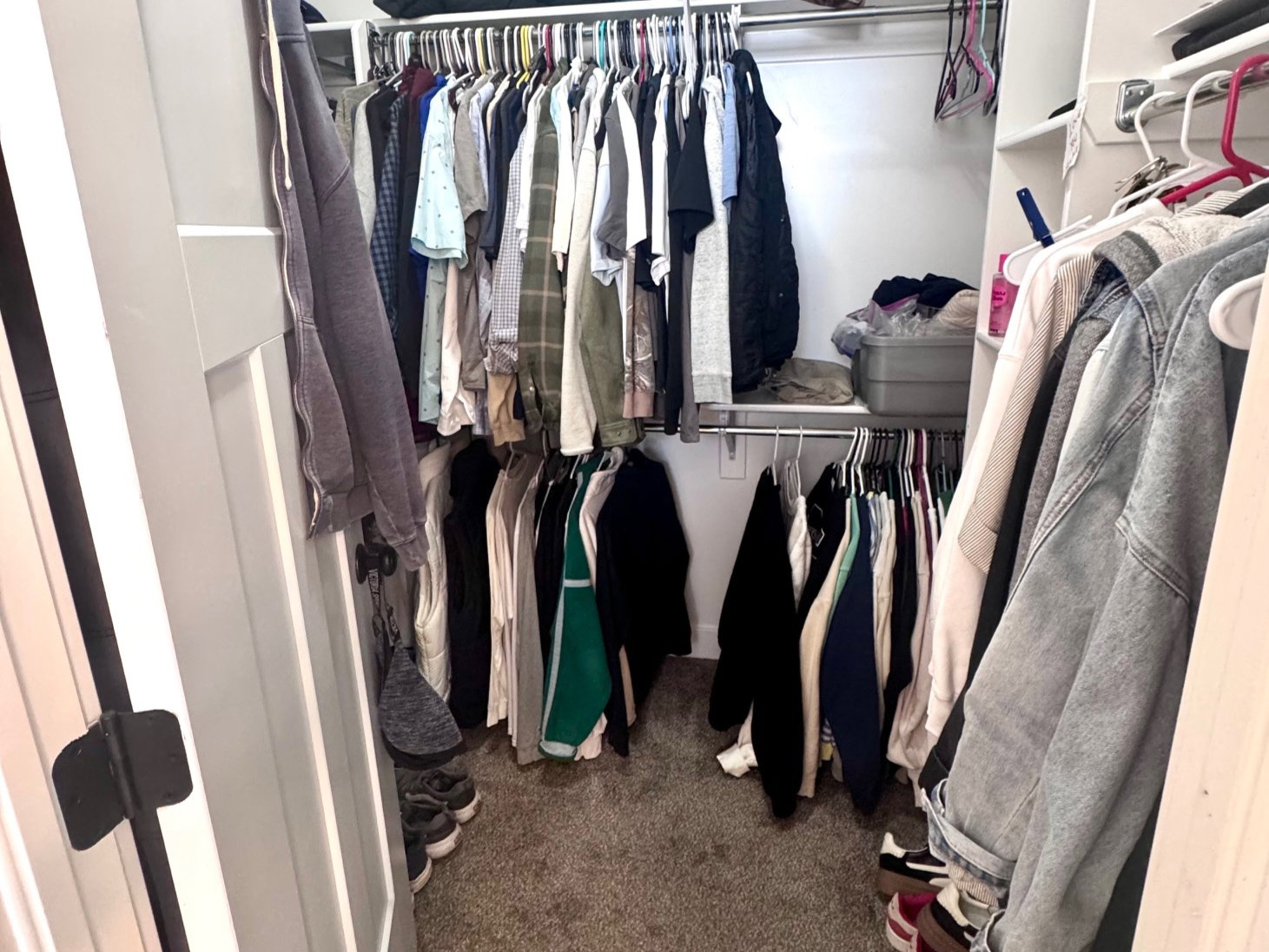 Walk in closet with dark carpet