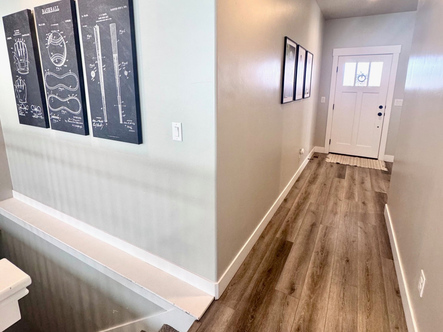 Corridor featuring a textured ceiling and dark wood-style flooring