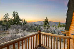 Wooden terrace featuring a mountain view