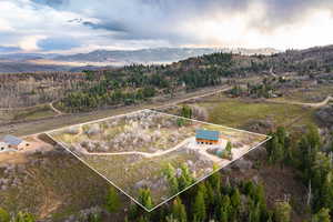 View of property location featuring property boundaries highlighted and a mountain backdrop