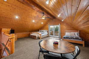 Carpeted bedroom with log walls, recessed lighting, a wooden ceiling with exposed beams, access to exterior, and a ceiling fan