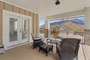 Wraparound covered balcony with expansive valley and mountain views, offering a private outdoor space for relaxing and entertaining.