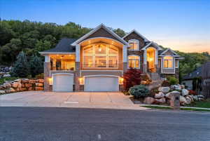 Custom-built Davis County home featuring valley and mountain views, located in a quiet South Weber neighborhood, close to hiking and biking trails, approximately 20 minutes from Snowbasin Ski Resort, and near multiple lakes.
