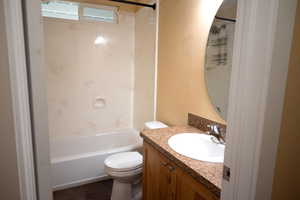 Bathroom featuring vanity and bathtub / shower combination