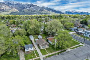 Aerial perspective of suburban area featuring a mountain backdrop