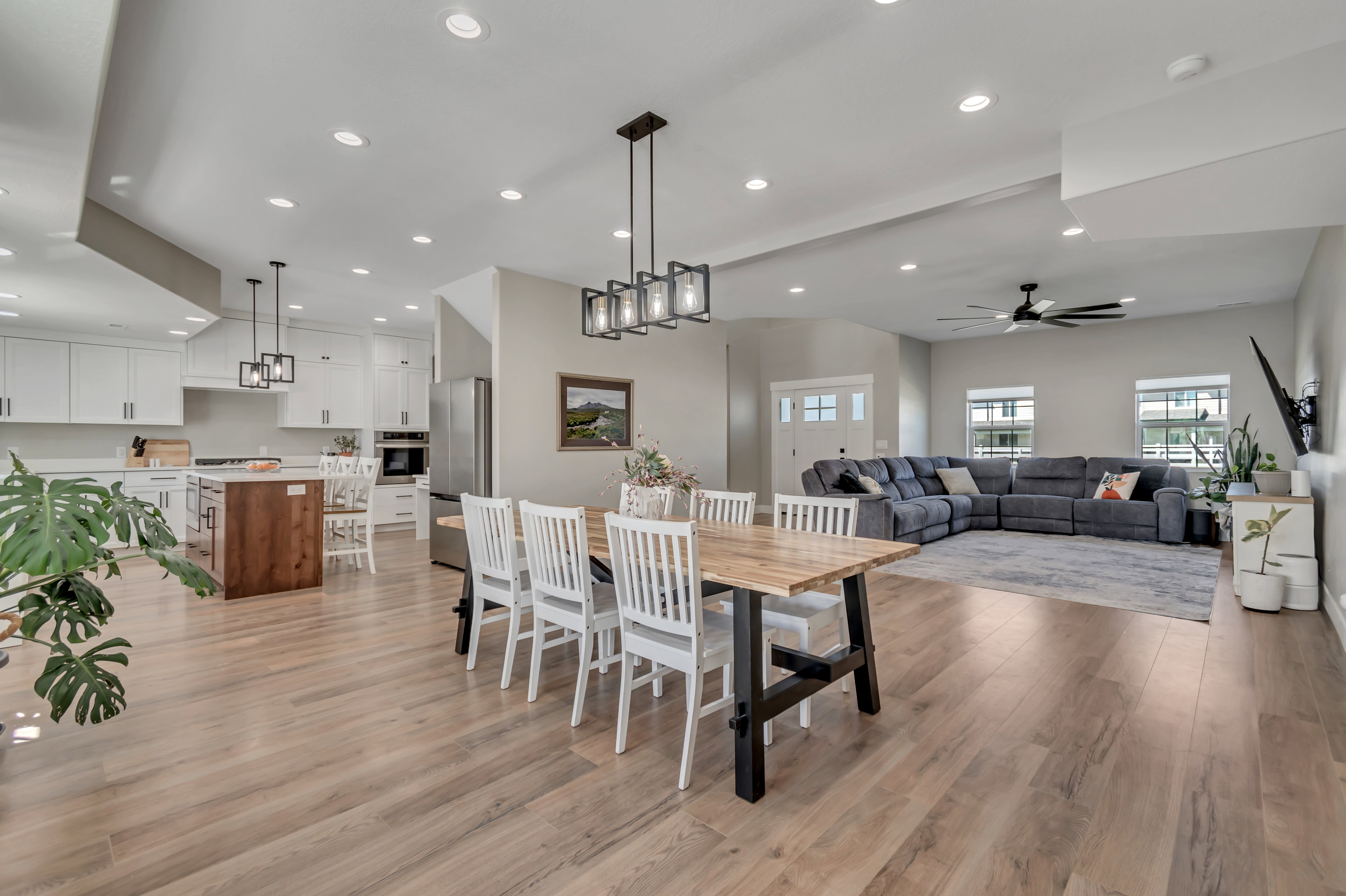 Dining space featuring light wood finished floors, recessed lighting, and a ceiling fan