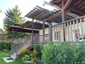 View of patio with a deck and a pergola
