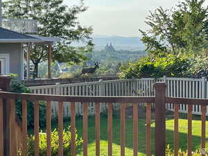 Wooden terrace featuring a mountain view