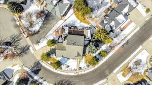 Snowy aerial view featuring a residential view