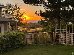 View of yard featuring a balcony