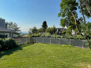View of fenced backyard