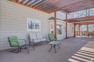 Deck featuring a pergola
