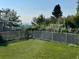 View of fenced backyard