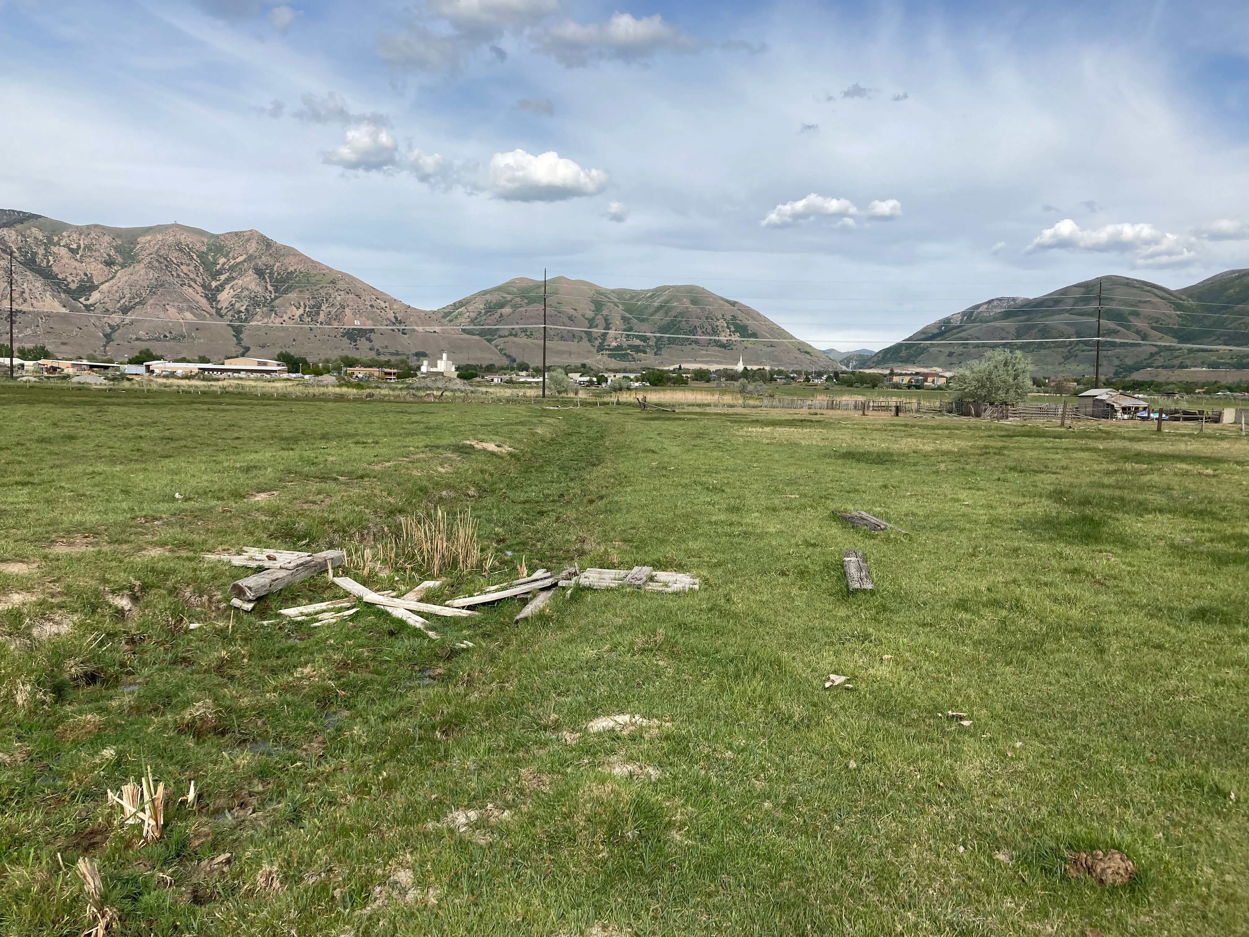View of mountain backdrop featuring rural landscape
