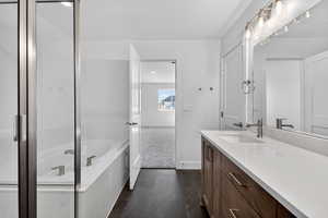 Bathroom featuring vanity and a garden tub