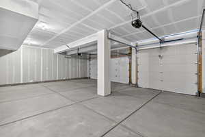 Garage featuring a garage door opener